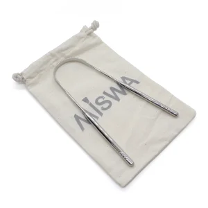 Gratte-langue en inox MISWA posé sur son pochon en coton